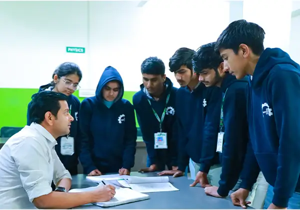 Teacher solving student doubts at the Matrix NEET Division doubt counter